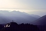 Silhouetted Hikers on Outcropping